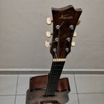DIY guitar stand with a guitar mounted on it, viewed from the front, and slightly elevated.
