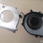 A laptop CPU heatsink fan taken apart for cleaning.